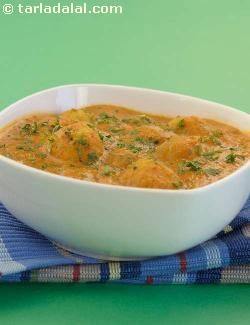 Dum Aloo, baby potatoes in a creamy, appetizing tomato based gravy.