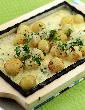 Sizzling Potatoes in Cheese Sauce
